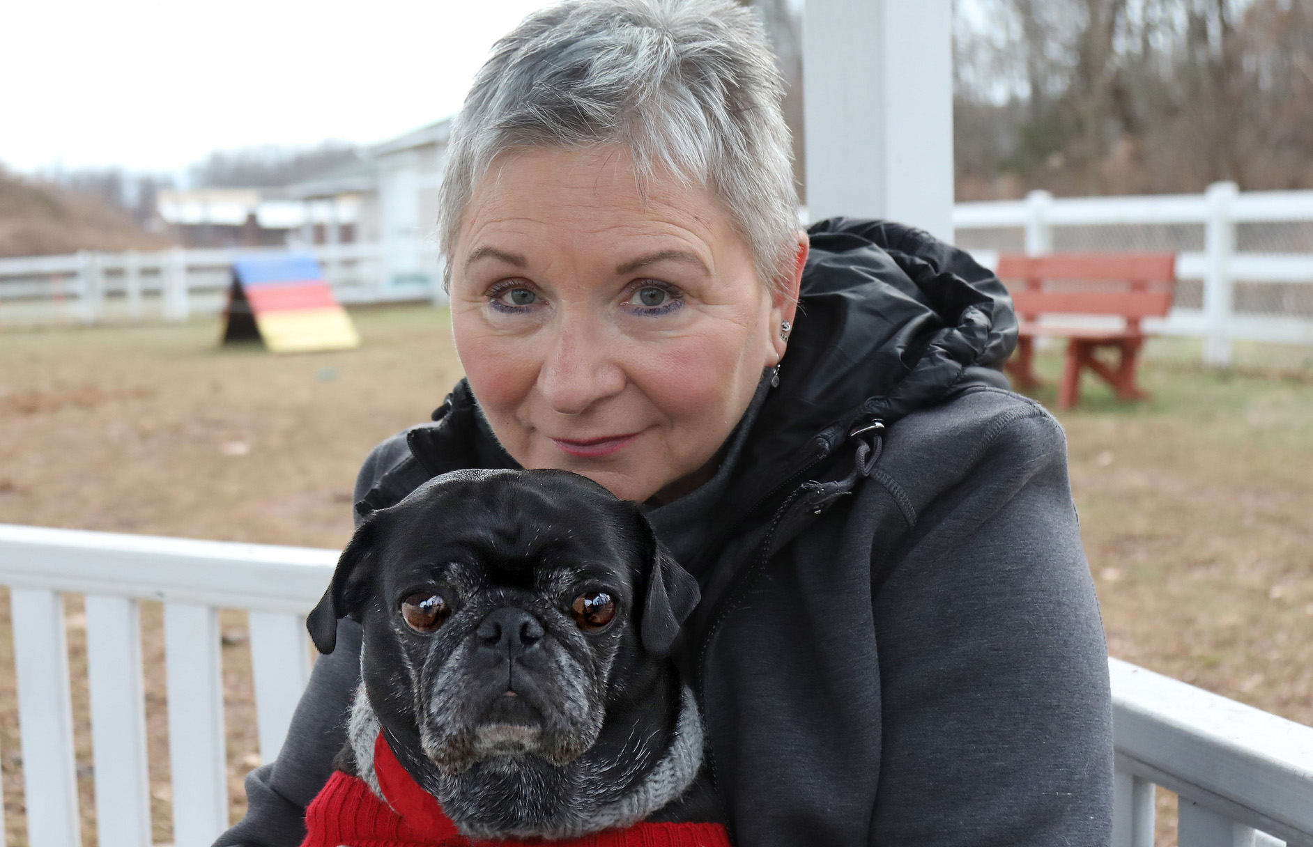 woman with black pug