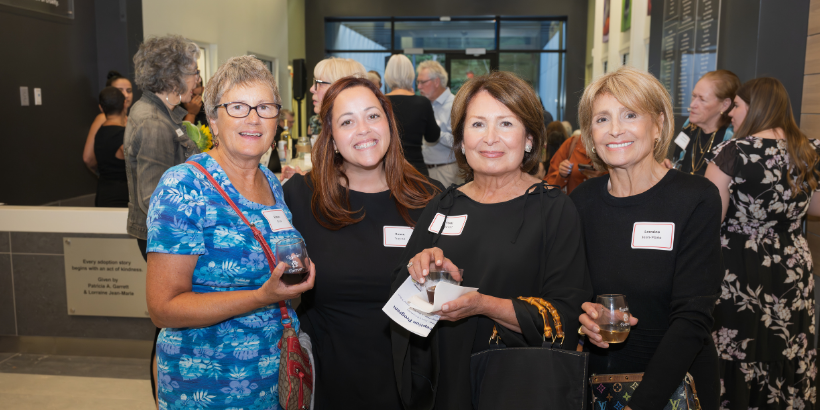 four women smiling