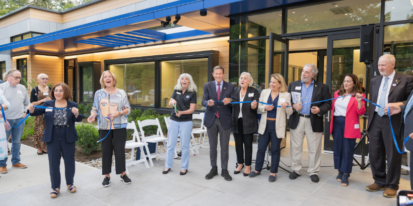 people at a ribbon cutting